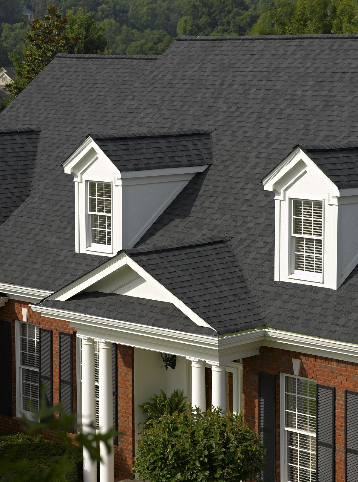 Large house with immaculate gray-colored roofing