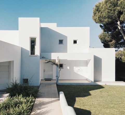 Front view of a white, modern home